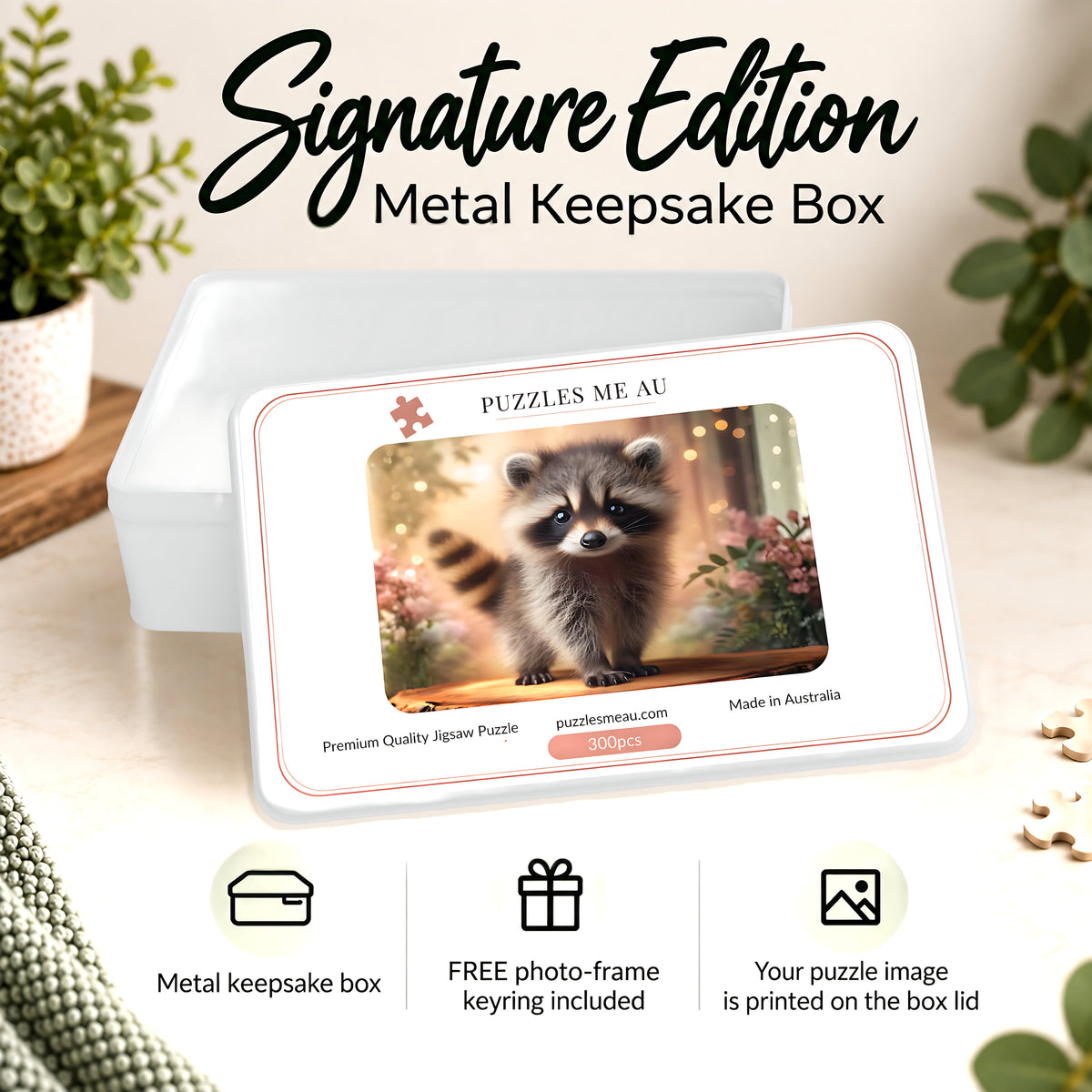Puzzles Me AU Signature Edition metal keepsake box for baby raccoon 300-piece wooden puzzle - wide-eyed raccoon with soft pink florals and bokeh light, premium gift-ready packaging, handmade in Queensland Australia
