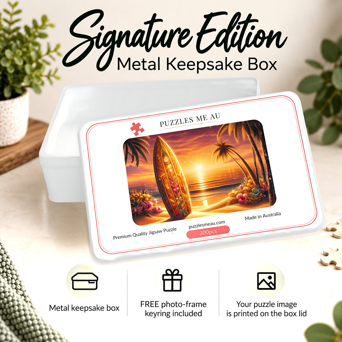 Puzzles Me AU Signature Edition metal keepsake box for sunset surfboard beach 300-piece jigsaw puzzle - ornate surfboard on sandy beach with swaying palms and blazing orange sunset over the ocean, premium gift-ready packaging, handmade in Queensland Australia