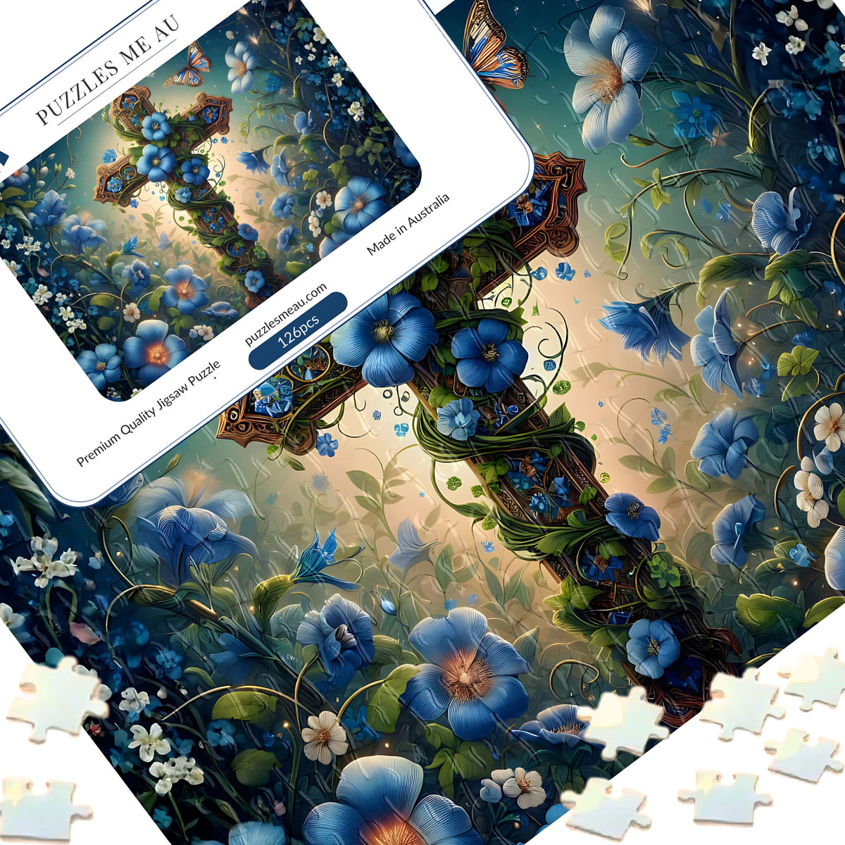 Floral cross blue garden 126 piece magnetic puzzle - puzzle pieces spread alongside Puzzles Me AU branded box and Signature Edition metal keepsake box, ornate cross entwined with blue florals and butterflies, handmade in Queensland Australia