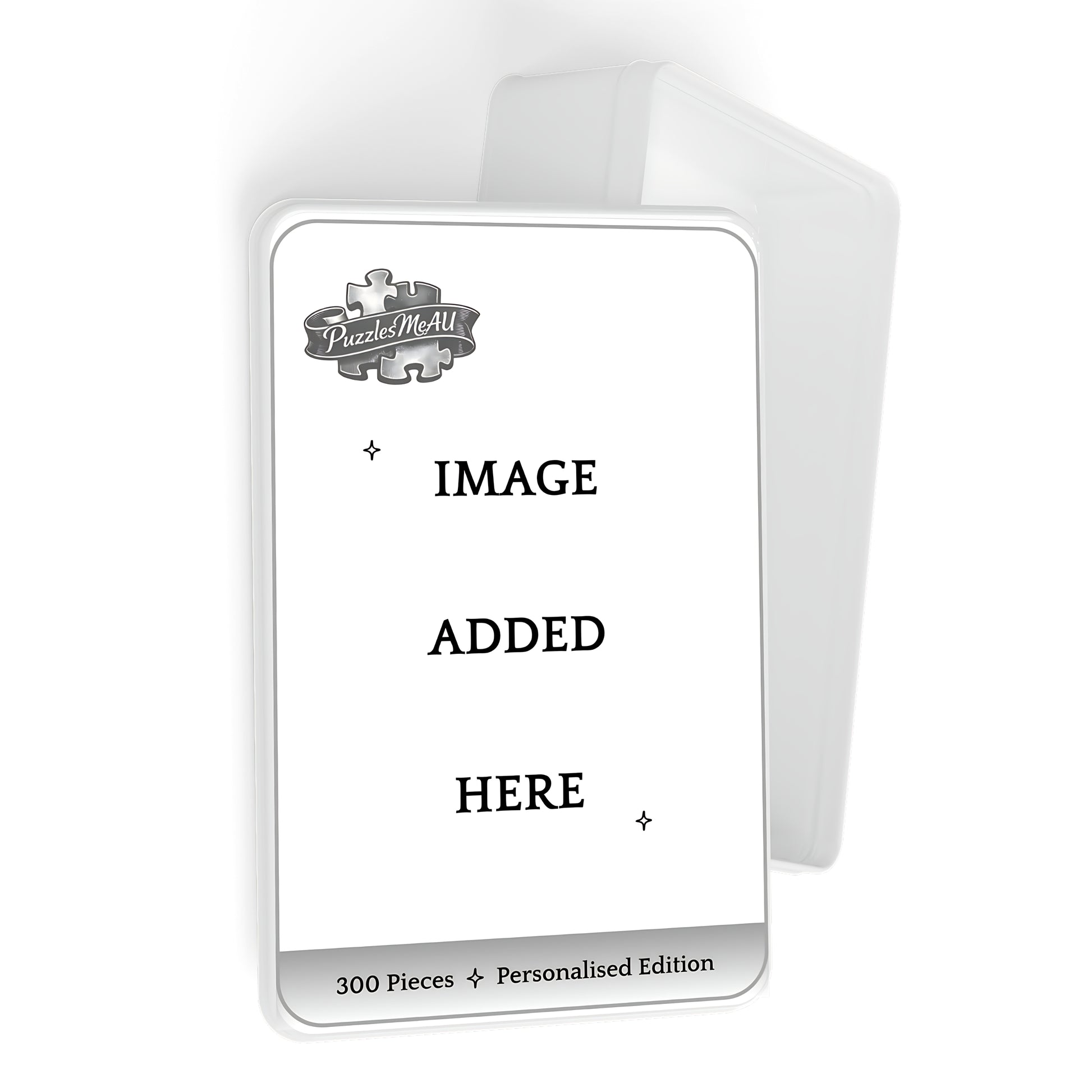 A customisable jigsaw puzzle box mockup on a white background. The front of the box is white with a grey border, featuring a placeholder logo for 'Puzzle Me All' and the text 'IMAGE ADDED HERE' along with '300 Pieces + Personalised Edition' at the bottom.
