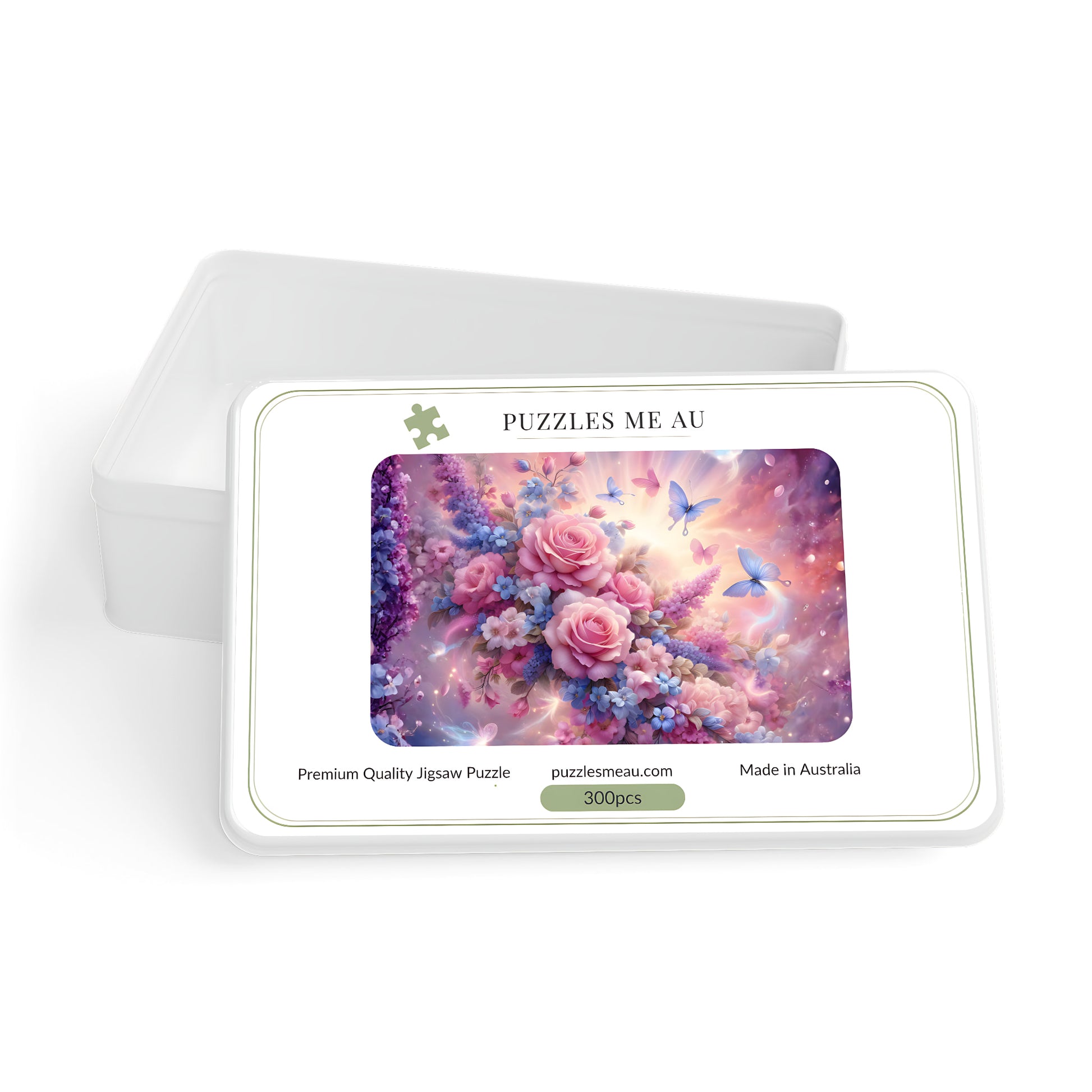 A 300-piece jigsaw puzzle in a white metal tin with a sliding lid, featuring a colorful floral design with pink roses, blue butterflies, and a purple galaxy background. The brand name 'PUZZLES ME AU' is printed at the top of the puzzle tin.
