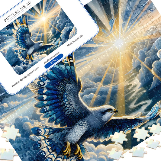 Soaring falcon 300 piece jigsaw puzzle - puzzle pieces spread alongside Puzzles Me AU branded box and Signature Edition metal keepsake box, vivid blue and gold bird of prey in dramatic sunlit sky, handmade in Queensland Australia